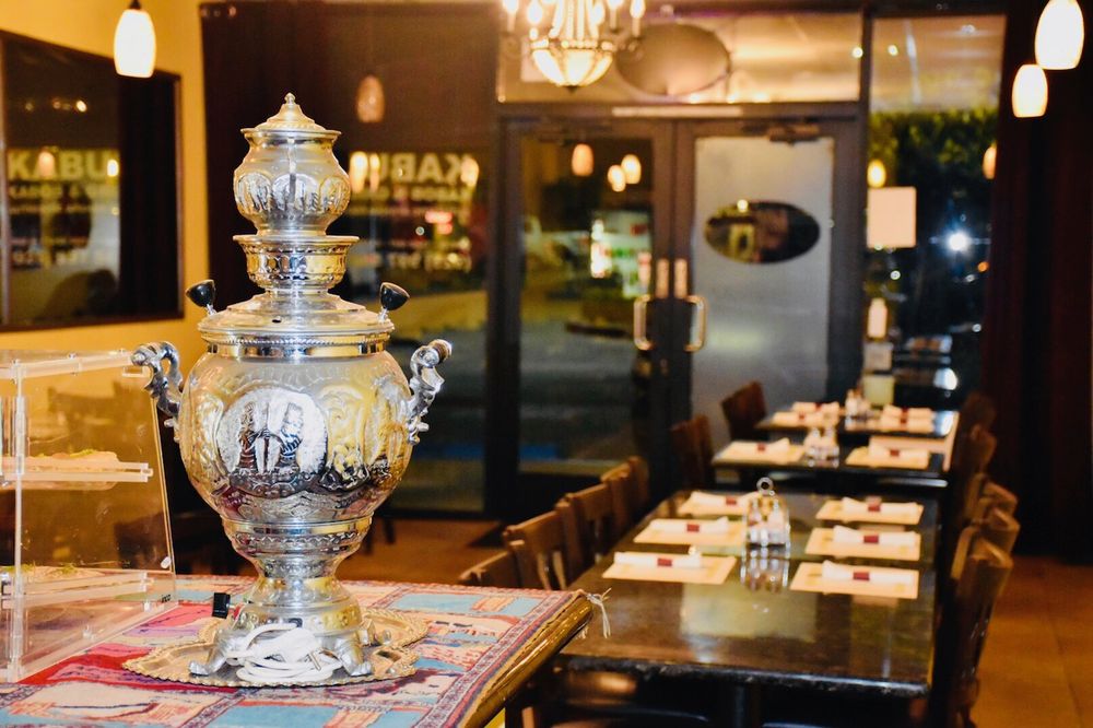Traditional Afghan cuisine served with fresh herbs and naan bread